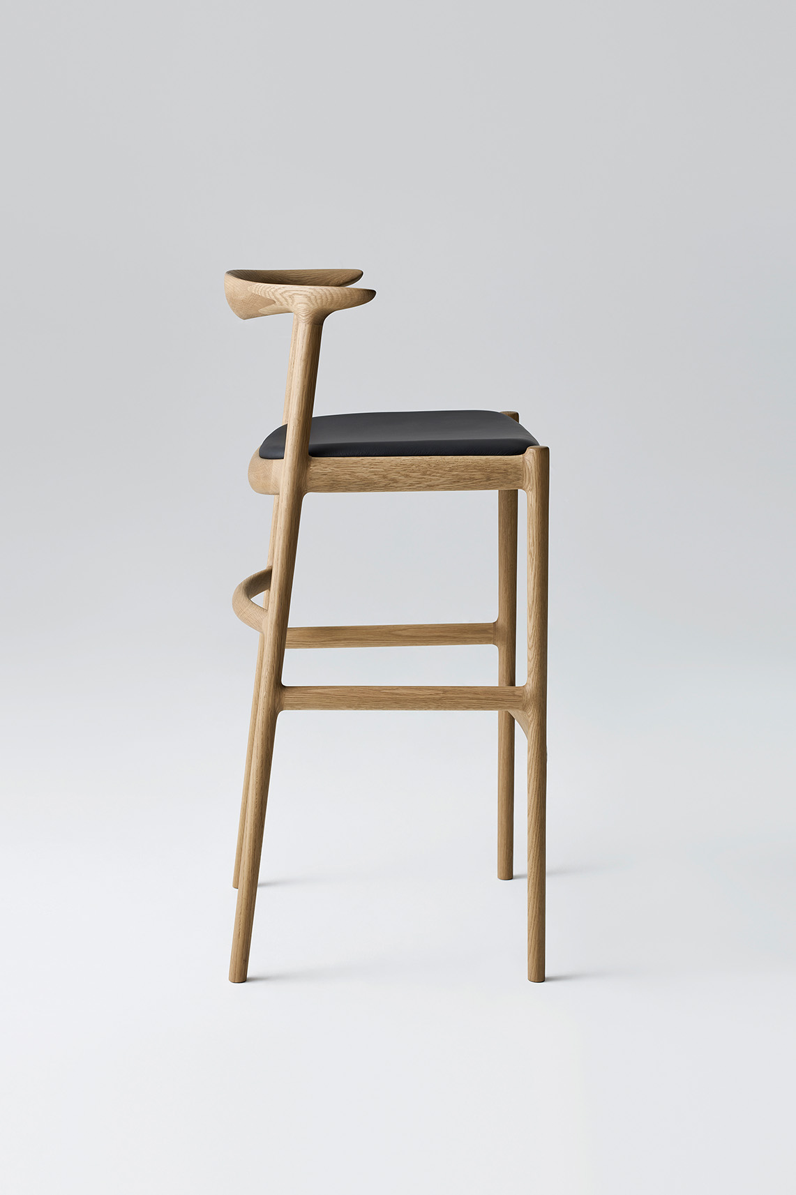 Bridge Bar Stool by Bernstorffsminde with natural oak frame and upholstered seat, shown in a clean studio setting.