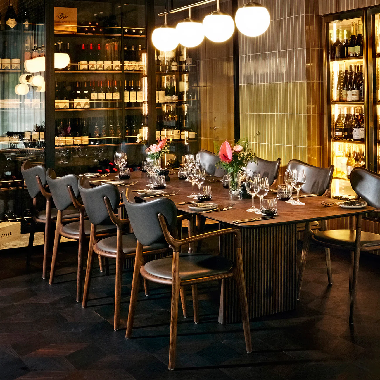 Ro Collection Salon Chairs in oak and leather arranged in a restaurant dining setting.